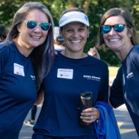 3 GVSU alumnae pose and smile towards camera